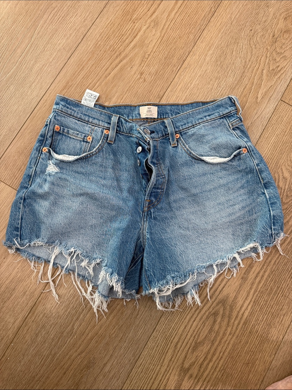 Levi's Distressed Frayed Hem Denim Shorts - Light Blue Wash